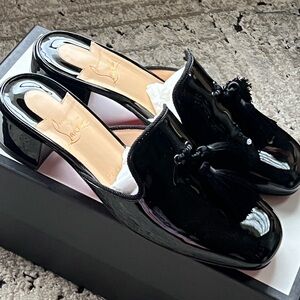 Christian Louboutin patten leather tassel mules